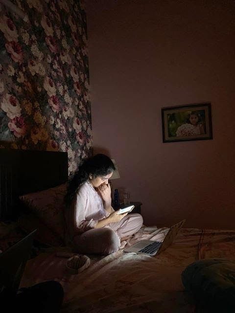 Ryerson student Aleeze Siddique illuminated by her laptop in her bed in Lahore, Pakistan.
