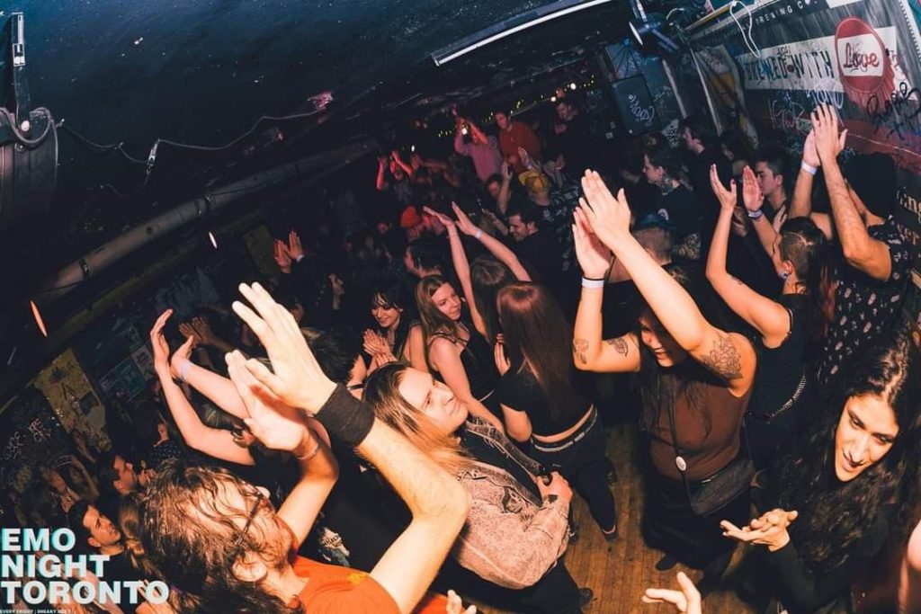 a crowd of dancers within Sneaky Dee's on an Emo music dance night called Homesick