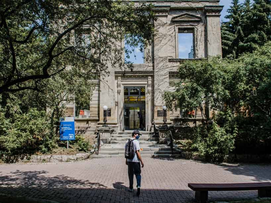 Man wearing mask outside Recreation and Athletics Centre