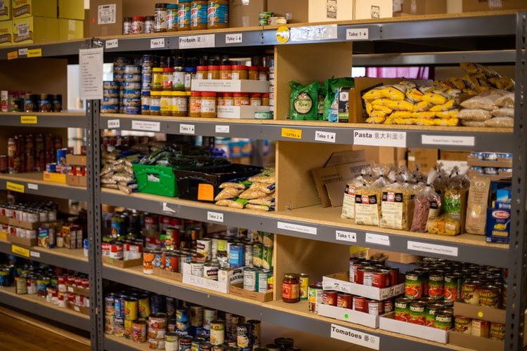 a full shelf at a grocery store with food