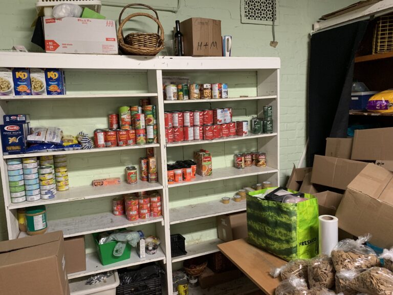 A photo shelves of food at a food bank.