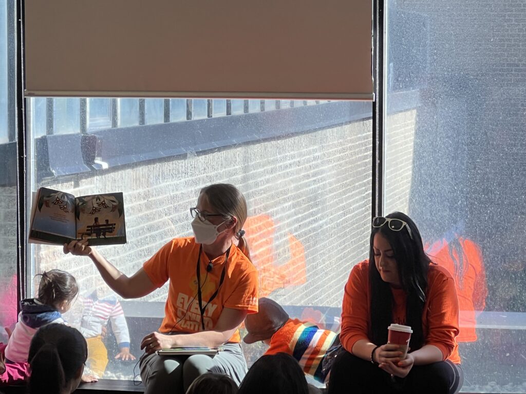 Jane Schmidt, liaison librarian, reading to the children on Orange Shirt Day. (Georgina Parker/On The Record)