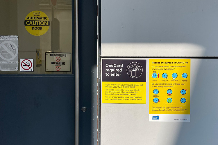 A yellow sign on the wall with tips on reducing the spread of COVID-19.