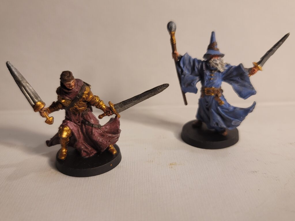 Two of Christopher Lai's painted miniatures photographed.