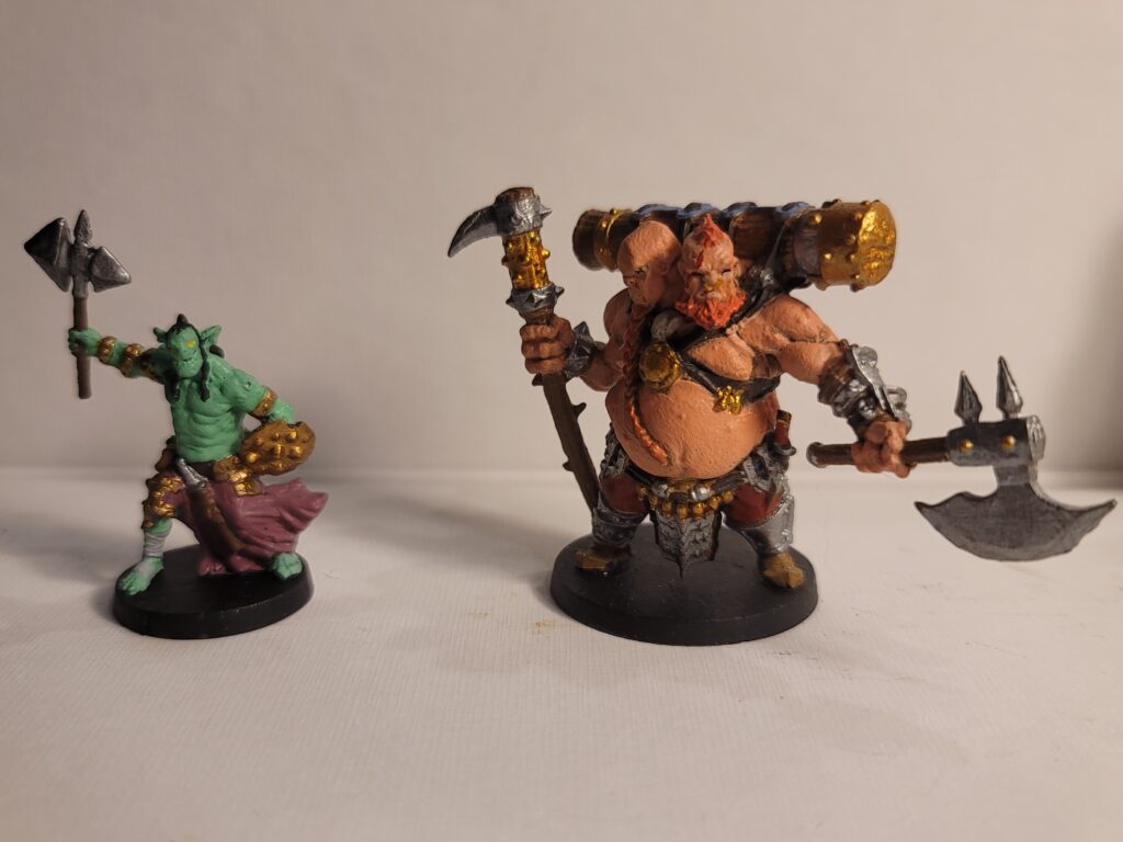 Two of Christopher Lai's painted miniatures photographed.