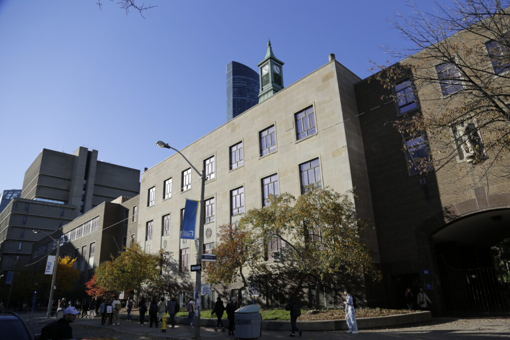 People walk in front of Kerr Hall's south side.