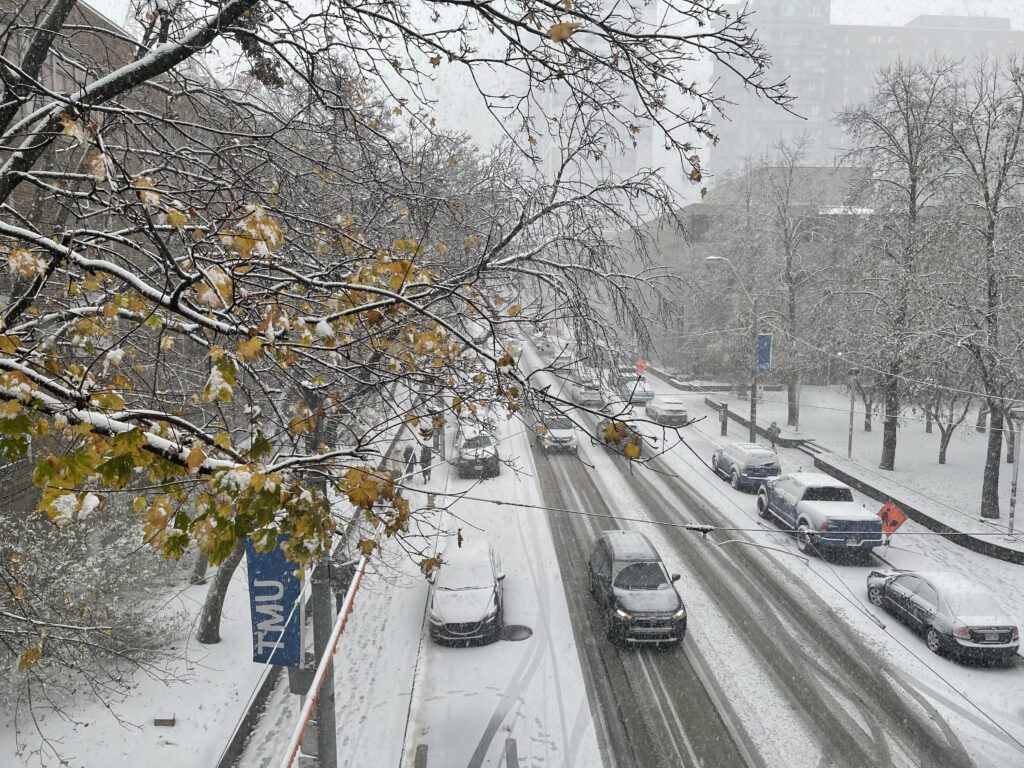 Photo of snowy Church street traffic in downtown Toronto.