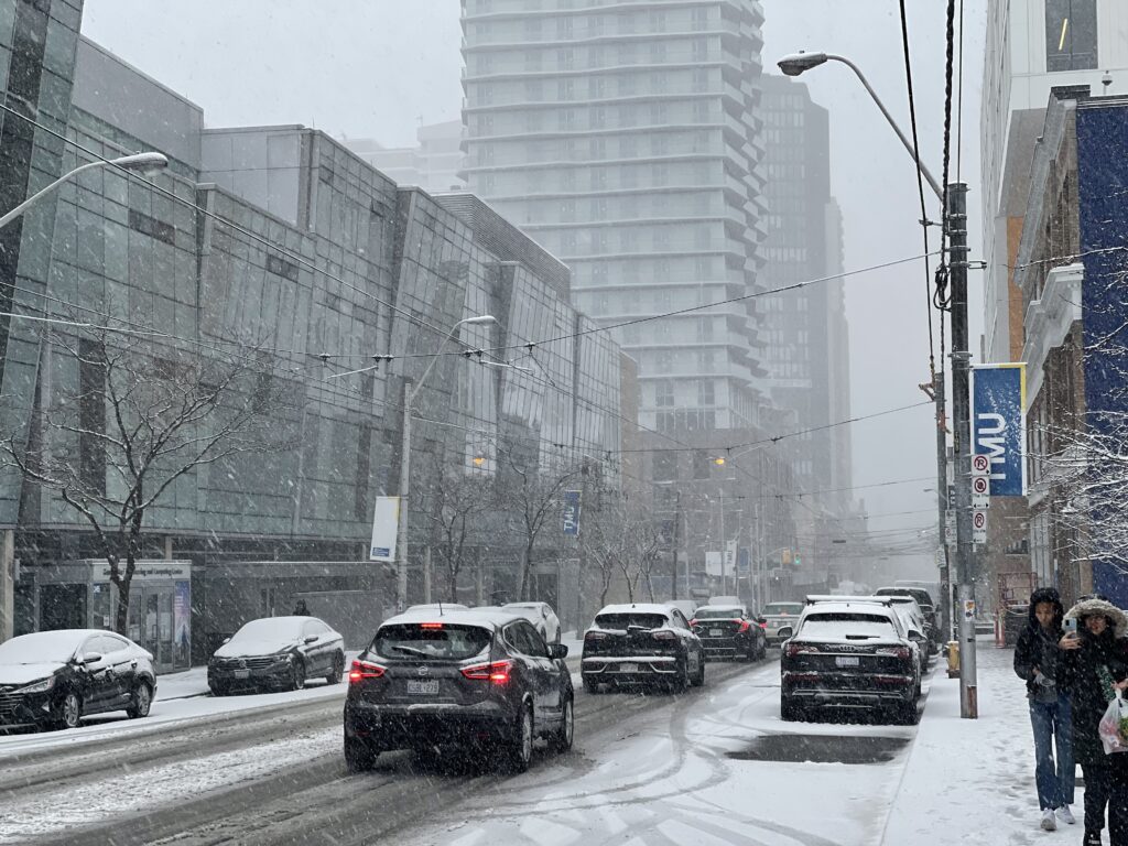 Image of Church Street experiencing snowfall for the first time.