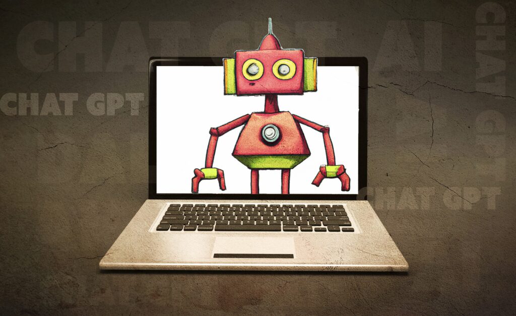 Stock image of laptop with drawn robot emerging out of laptop screen. 