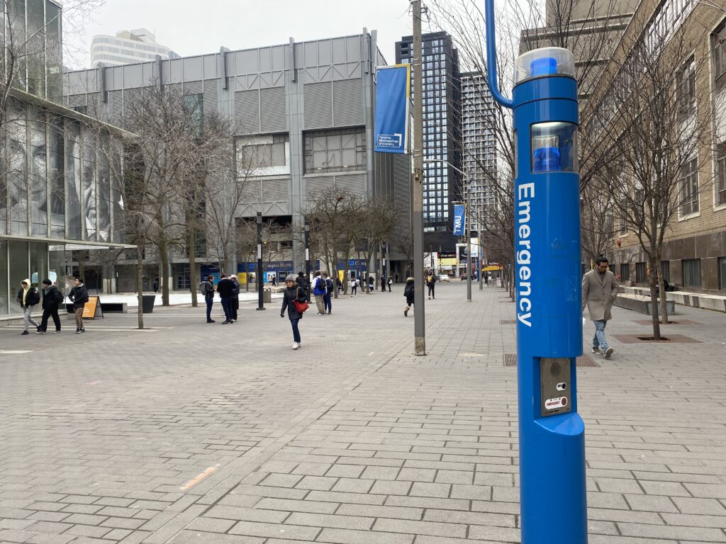 Photo of a blue emergency pole on campus.
