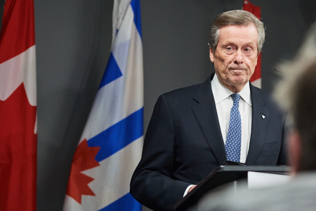 Photo of John Tory at a podium.