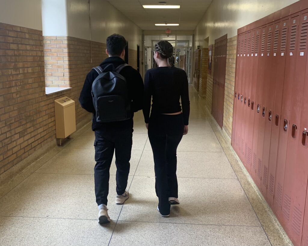two students walking down hallway in Kerr Hall