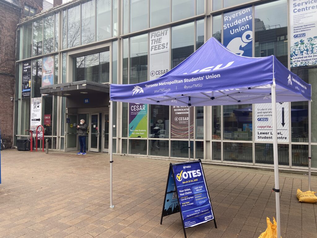 A photo of a TMSU canopy in front of the Oakham Cafe.