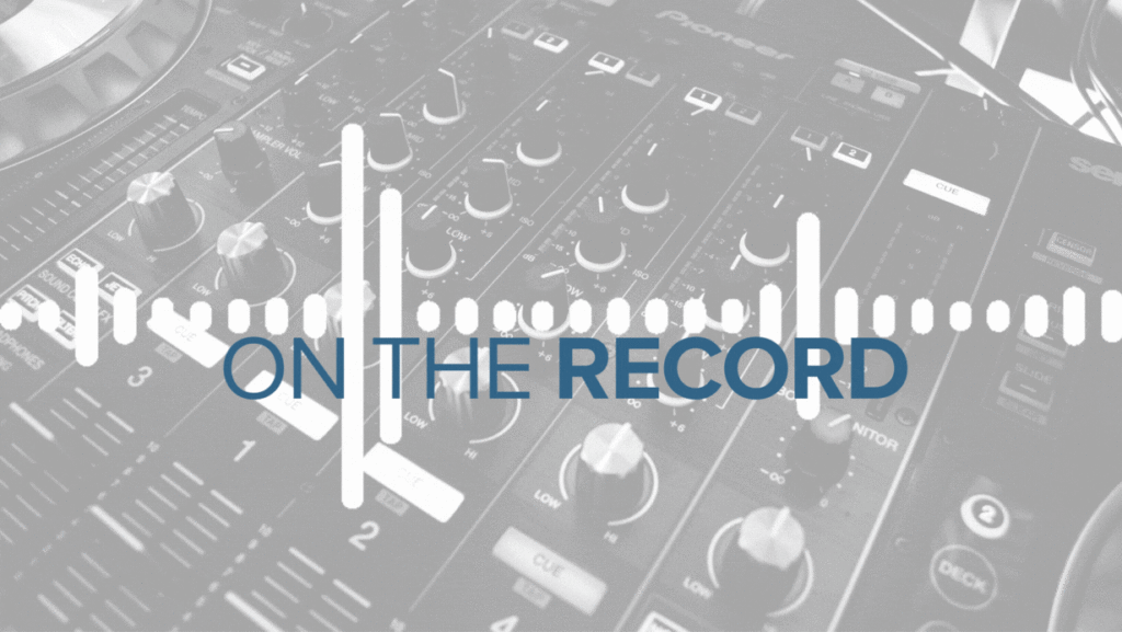 Grey and white photo of a soundboard with the logo for On The Record overlaid.