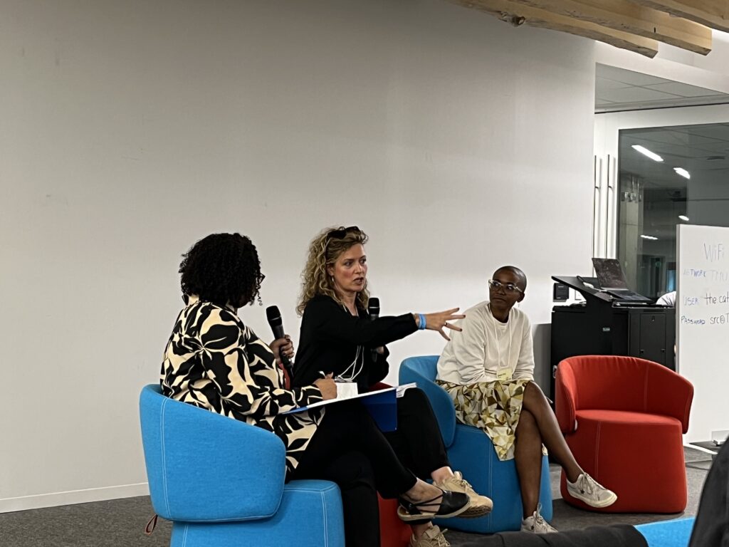 Shari Okeke moderating a panel discussion with Glenda Cooper and Zanele Mji.