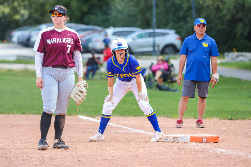 Photo of athletes on a baseball field.