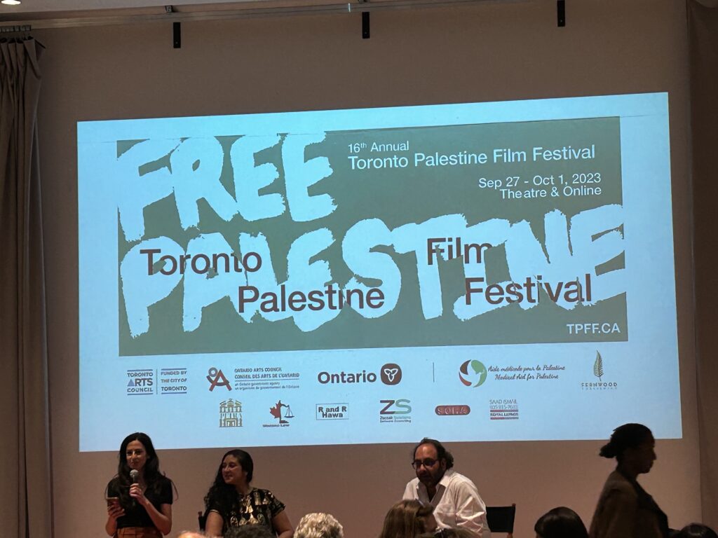 TPFF promotional poster at the backdrop of Fadi Kattan and Mona Barsoum's panel that reads "Free Palestine" and below are the organizations that funded the festival.