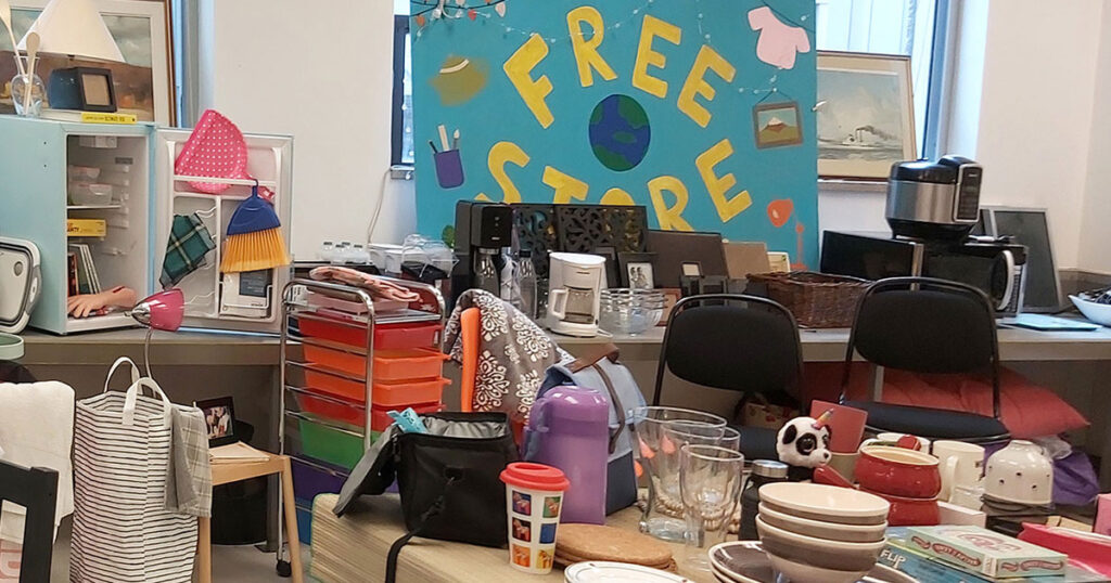 Photograph of the diverse goods available from the Free Store, including: desk, lamps, office chairs, kitchen items and more.
