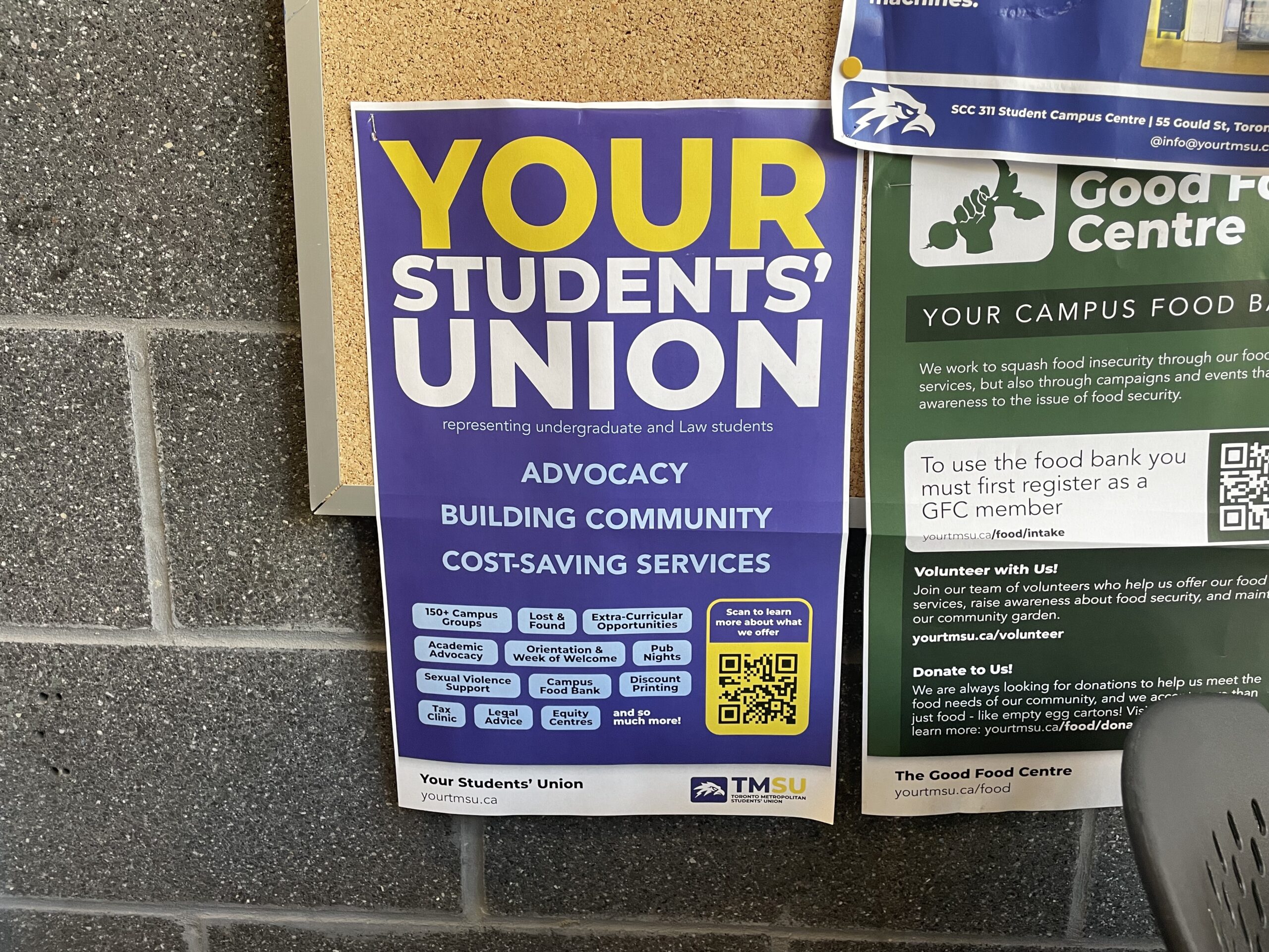A TMSU poster that reads in white and yellow text "YOUR STUDENTS' UNION" posted on a on-campus bulletin board in the SCC.