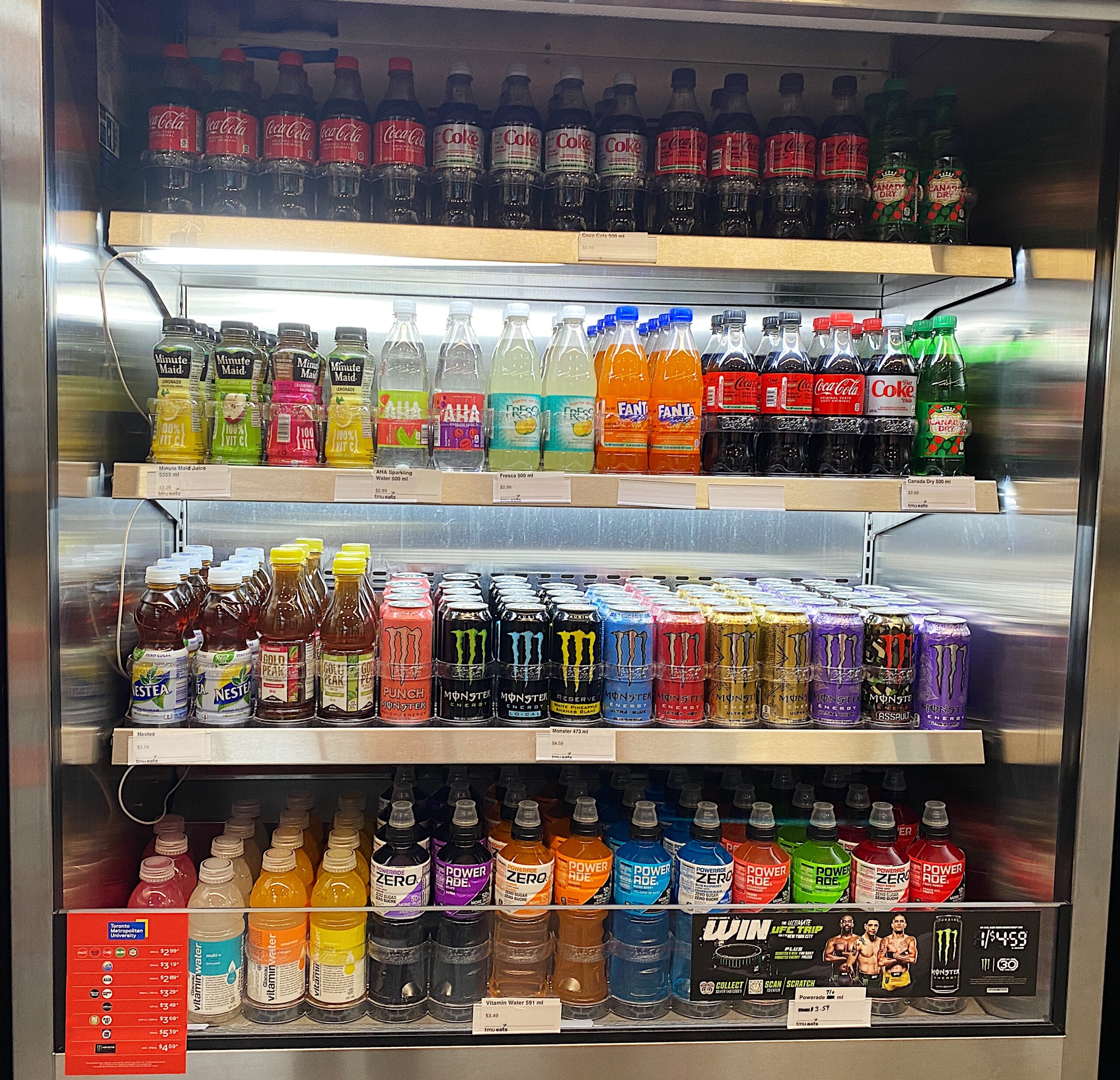 A store fridge stocked with drinks.
