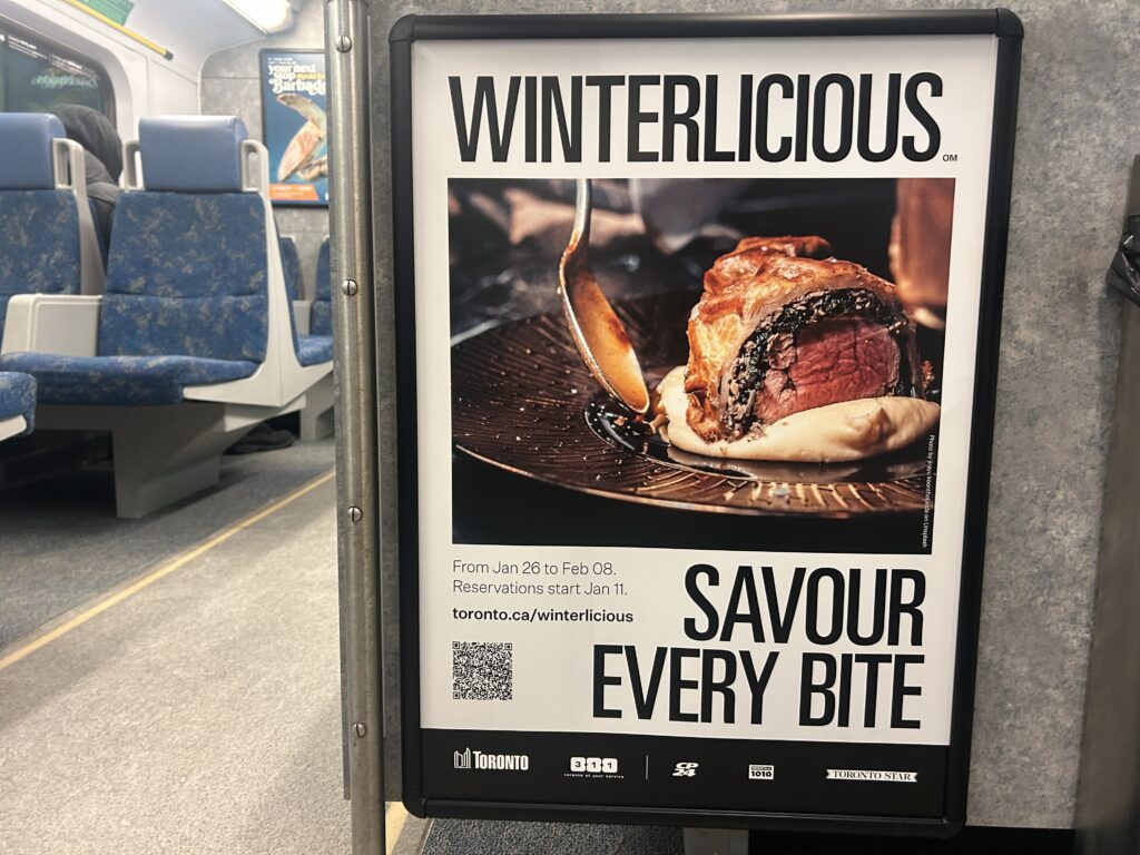 A picture of a Winterlicious advertisement on the GO train