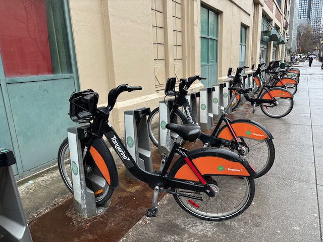 A photo of a row of bikes in their BikeShare stalls.