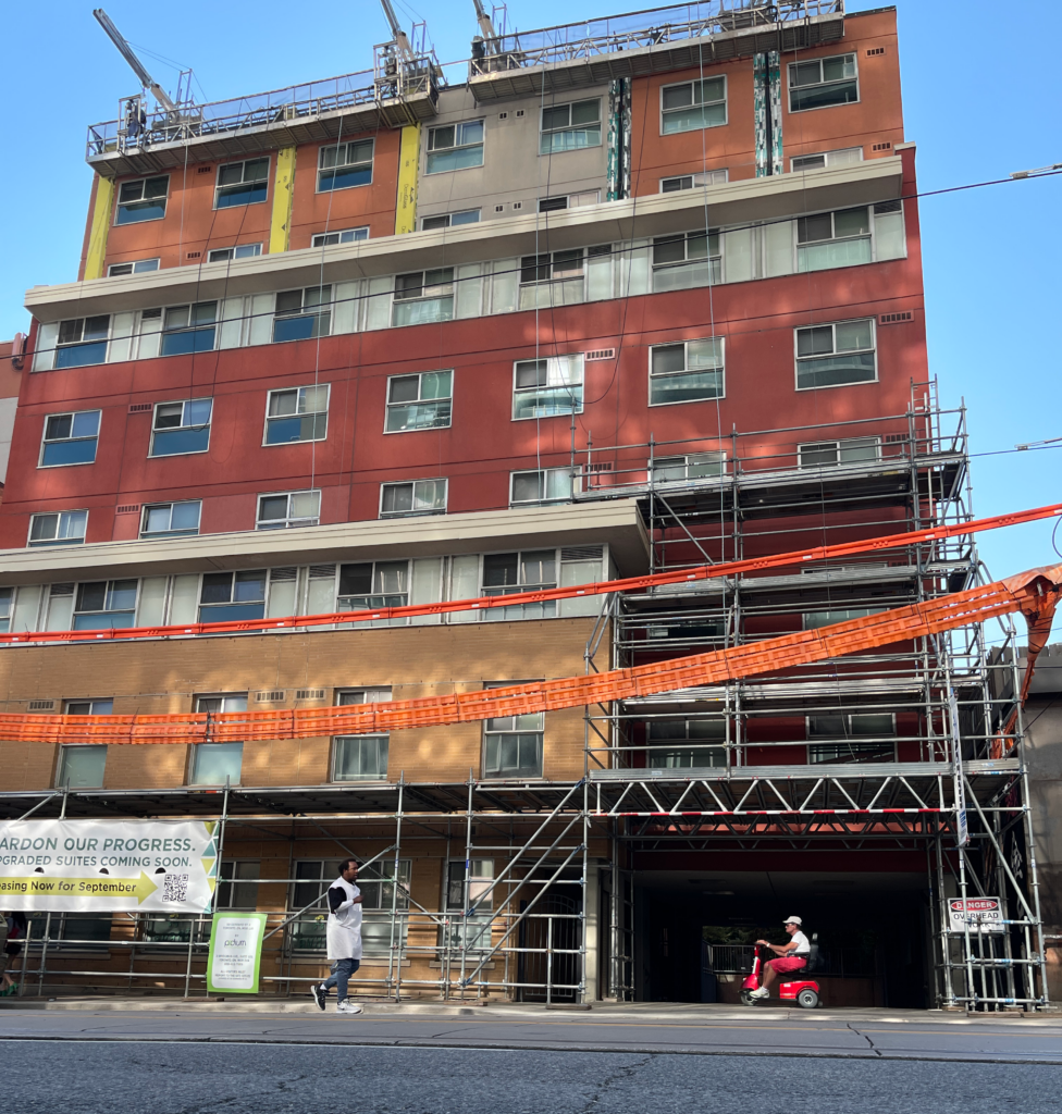 A building stands under construction at the intersection of Gerrard & Church St. 