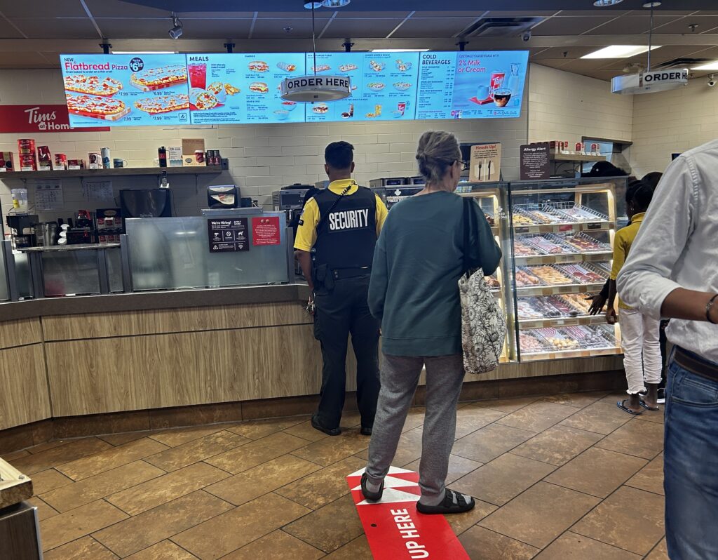 Security officer in line at Tim Hortons