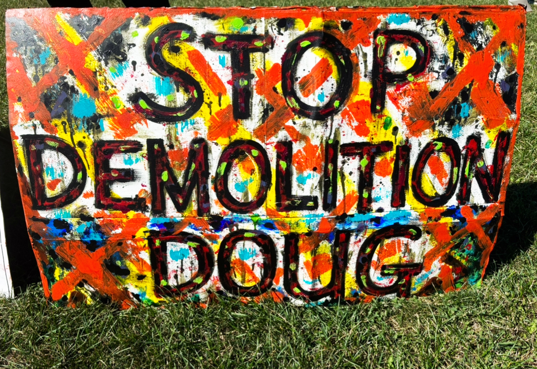 Bright coloured poster with the words "STOP DEMOLITION DOUG"