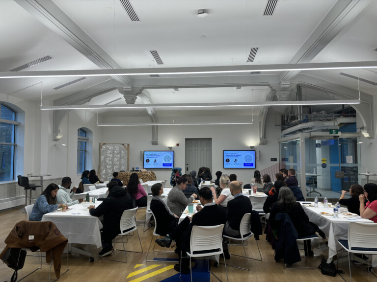 Attendees eating at event