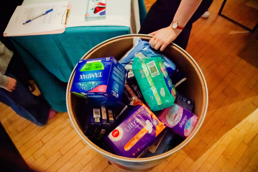 A top down view of a bucket containing  donated period products