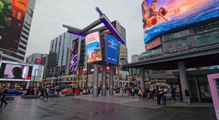 Shot of Yonge Dundas square, people walking by on a cloudy day.