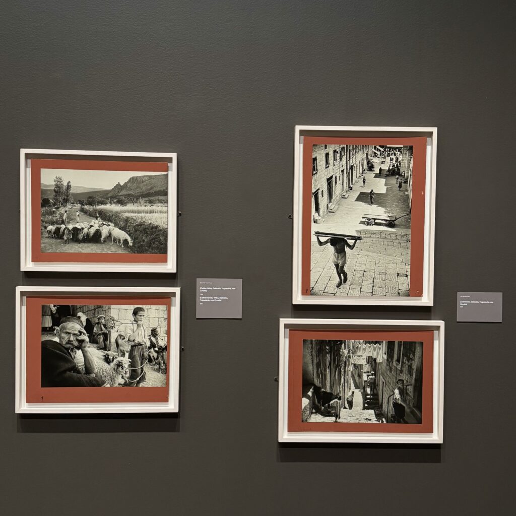 Four of the photographs from the "Magnum's First" exhibition hung on the wall.