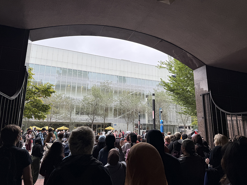A photo of people gathered for protest outside of Kerr Hall Quad.