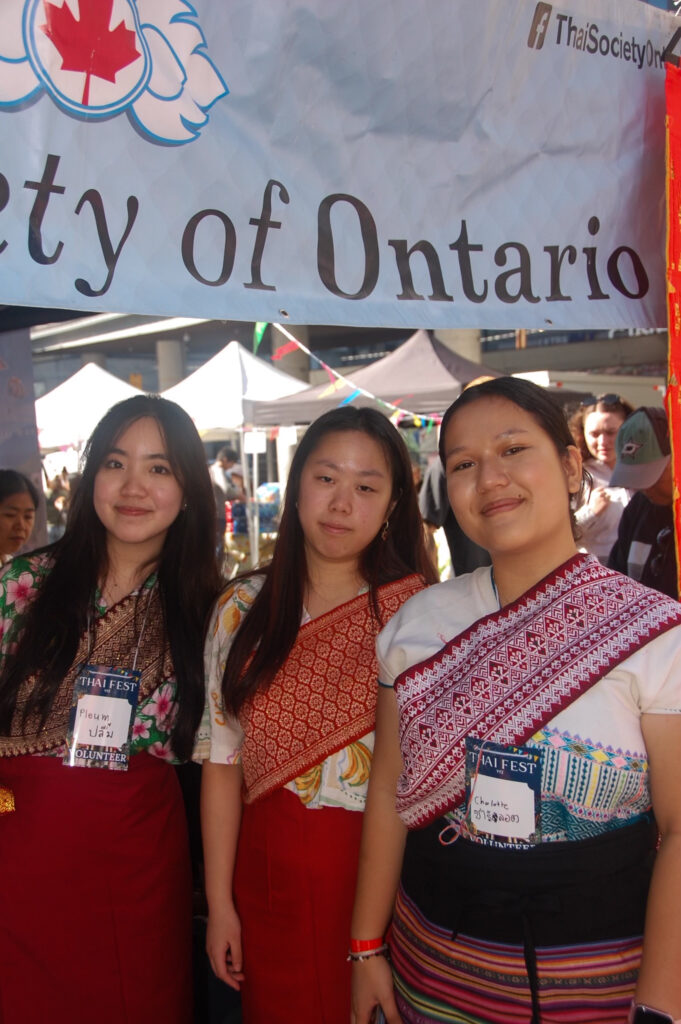 This is a photo of three women smiling.