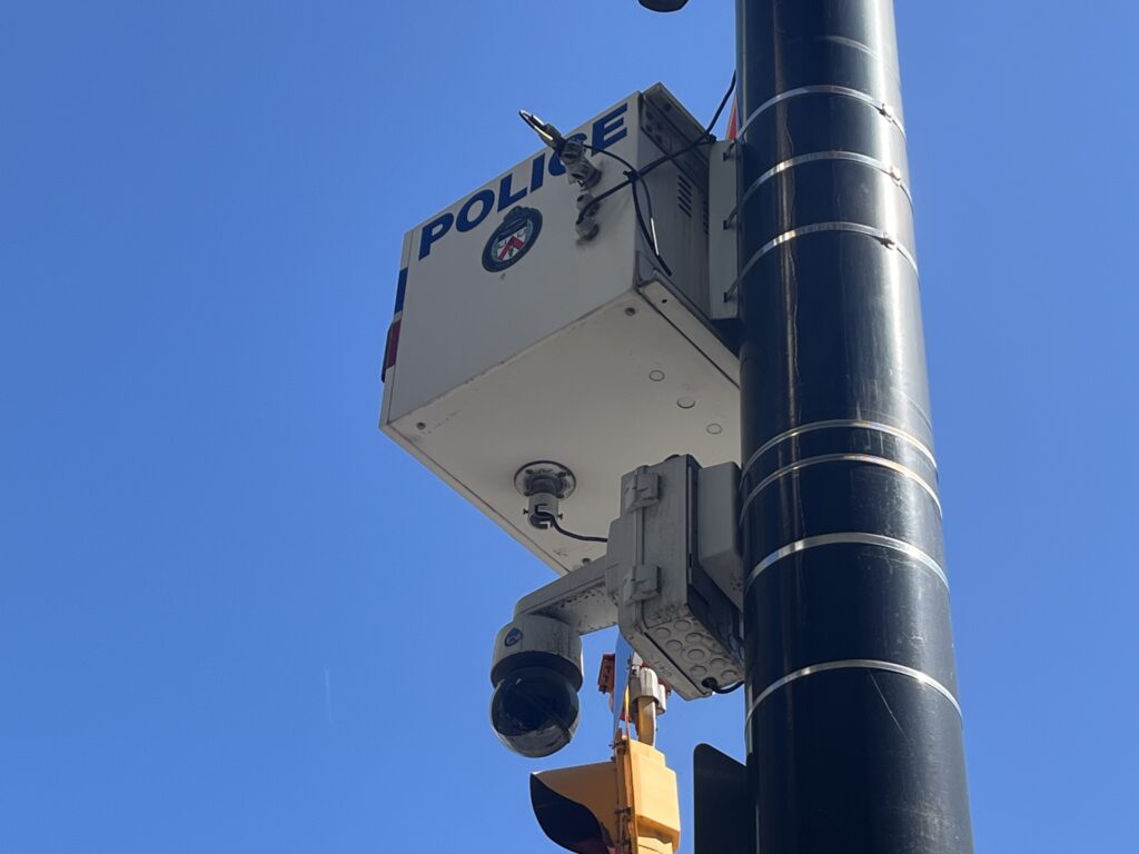 A photo of a police speed ASE box on a traffic pole.