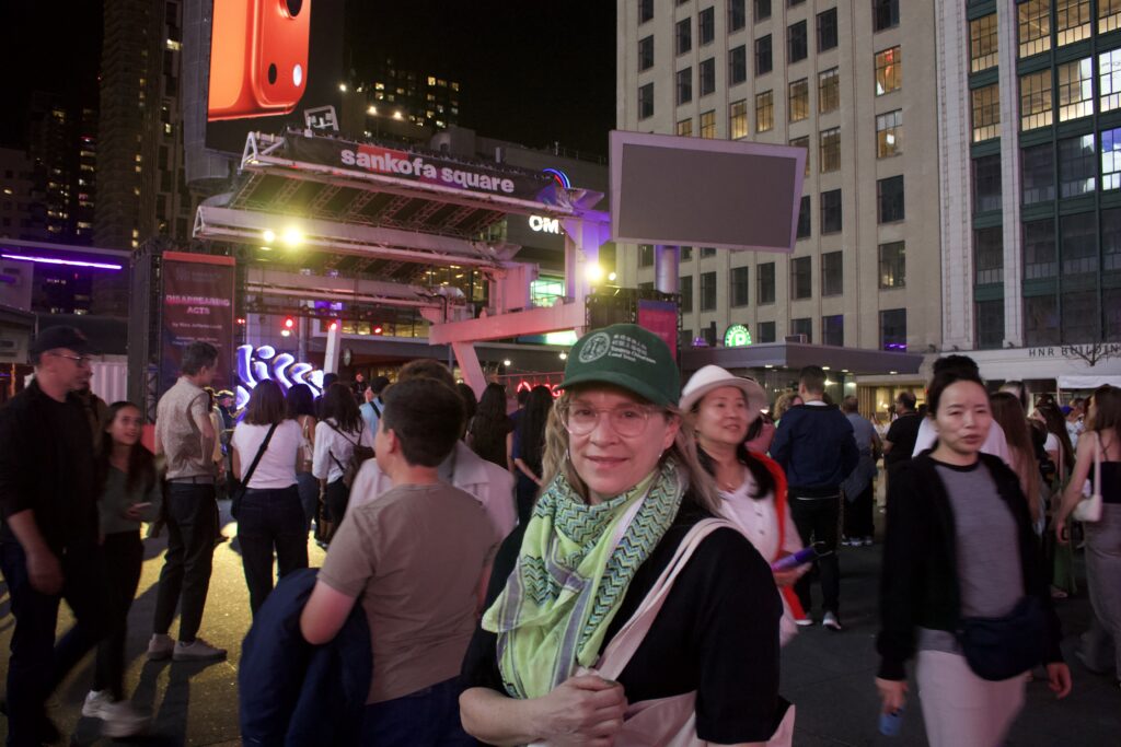 A photo of Erika Hennebury at Sankofa Square for the "Disappearing Acts" installation