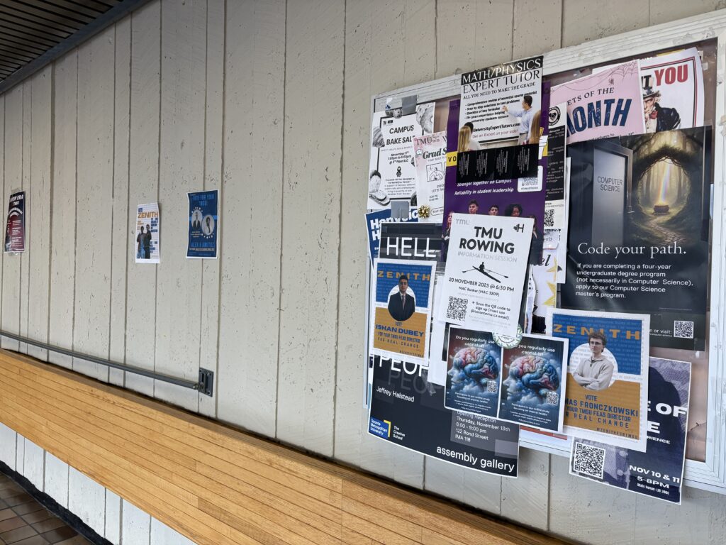 Flyers taped to wall and pinned to bulletin board