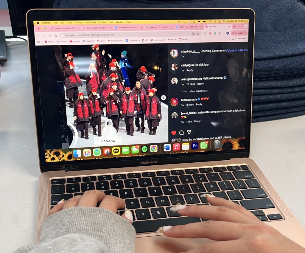 A photo of someone on a laptop looking at an instagram post.