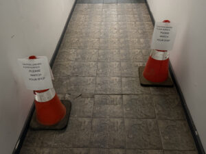 Hazard cones on the floor.
