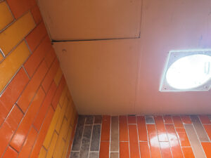 Damaged roof of an elevator.