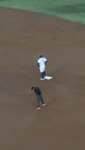 Baseball player standing on baseball mound