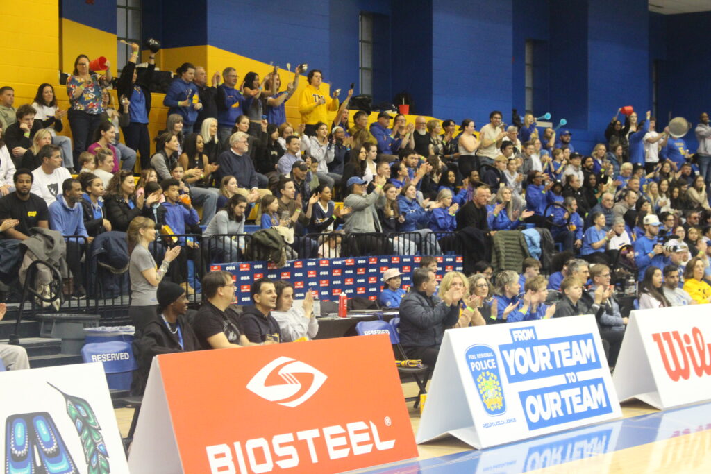 A crowd at a basketball game.