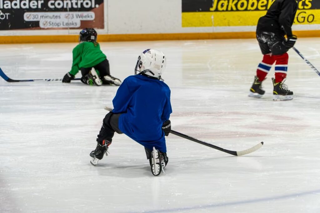 A photo of kids on the ice.