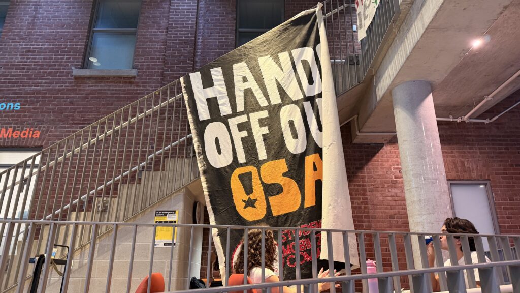 HANDS OFF OUR OSAP BANNER AT THE TMU STUDENTS' COMMUNITY CENTRE.