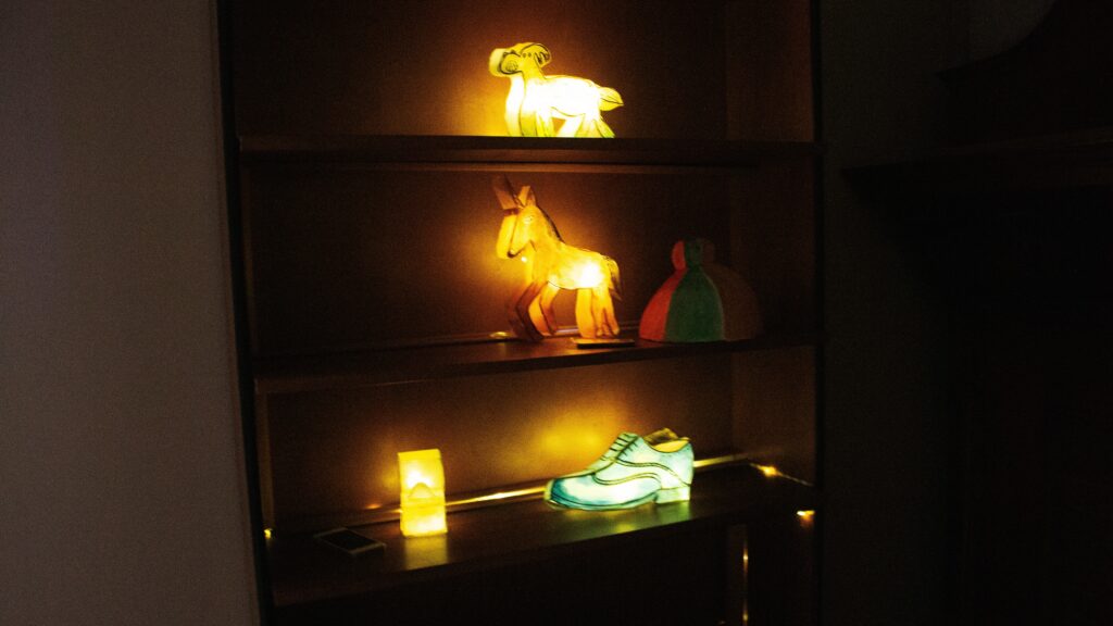 A bunch of shelves holding glowing objects.