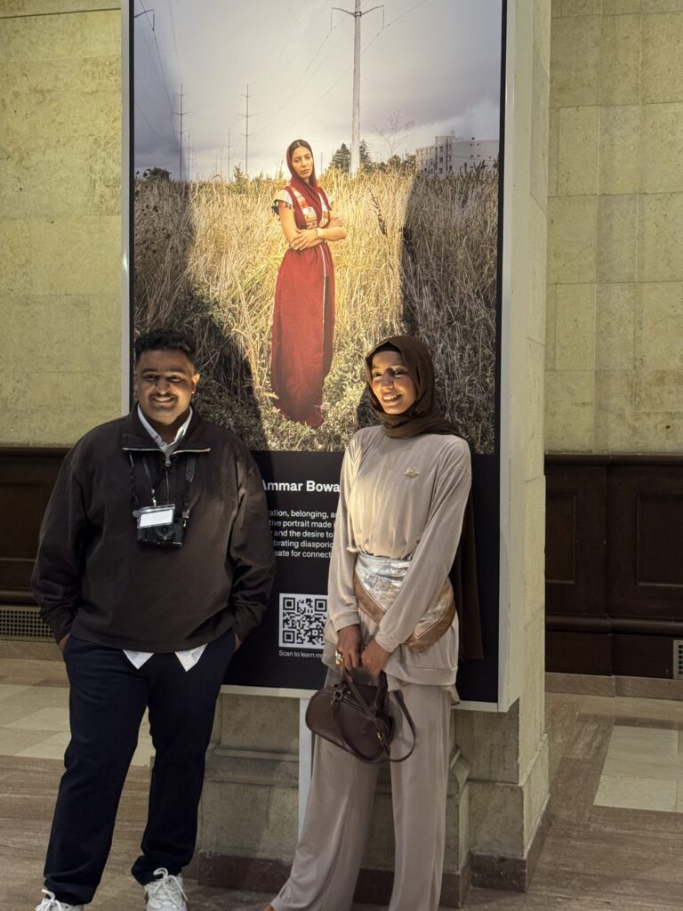 Ammar Bowaihl and his sister, Huda, stand before the portrait (OTR/Mostafa Al-A’sar)