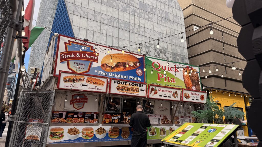 A photo of the Steak & Cheese restaurant with TMU’s Student Learning Centre visible in the background.
