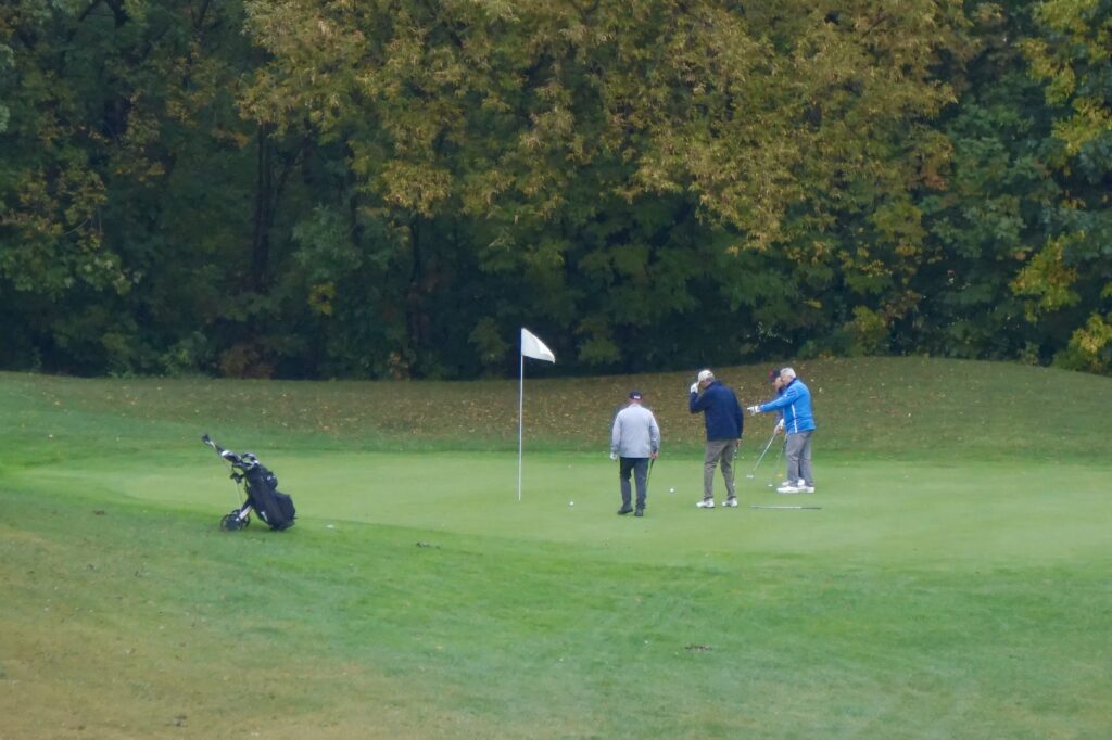 A group of golfers play on the Beddoe course. (OTR/Molly Simpson)